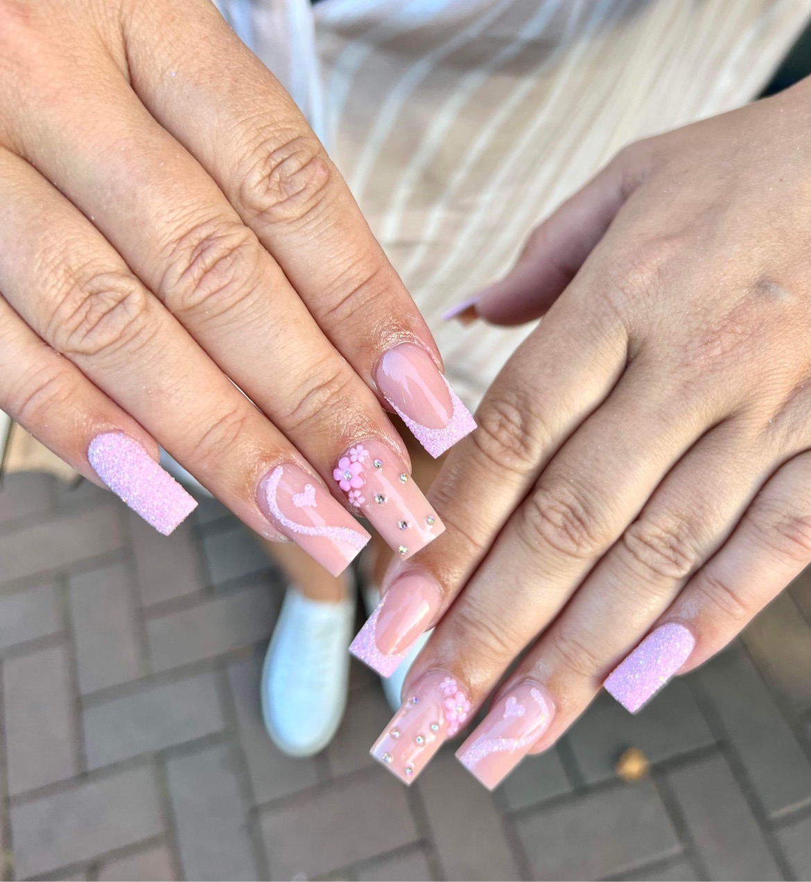 Soft pink coffin nails with 3D flowers and gems