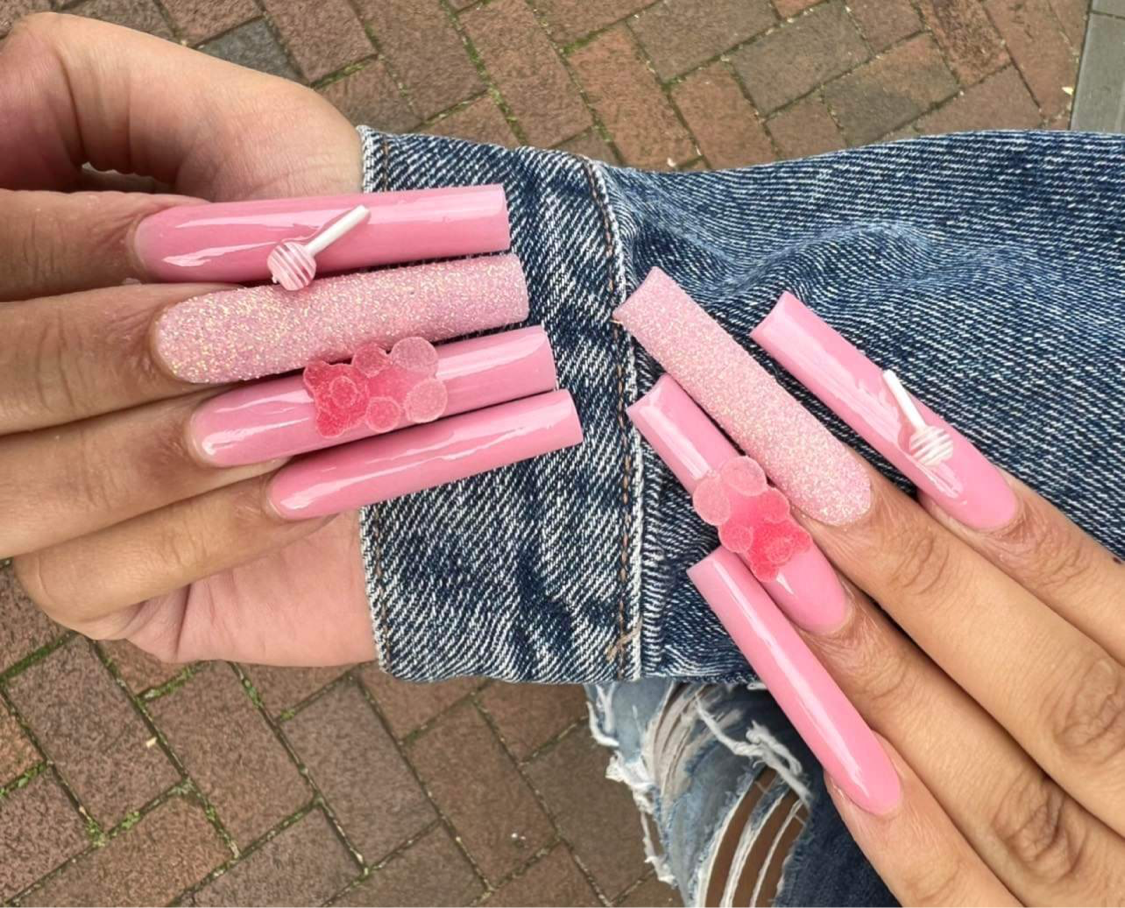 Glossy bubblegum pink extra long nails with charms